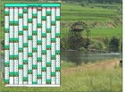 Calendrier 2027 annuel à imprimer, une colonne par mois, format paysage, placé sur une photographie